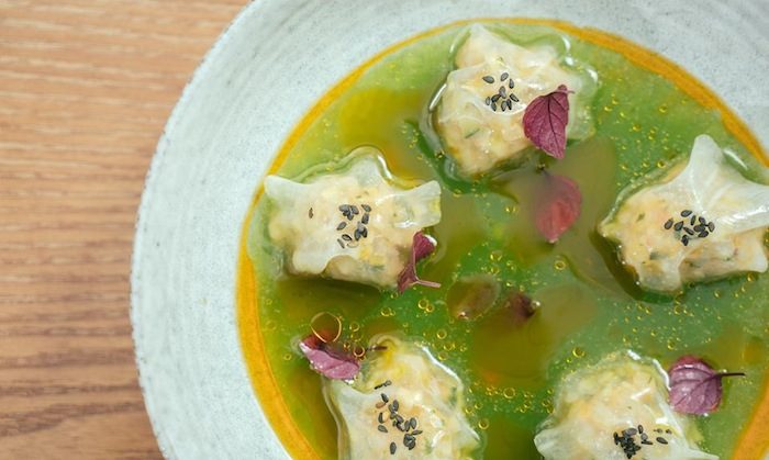 colourful dish of cucumber soup and langoustine